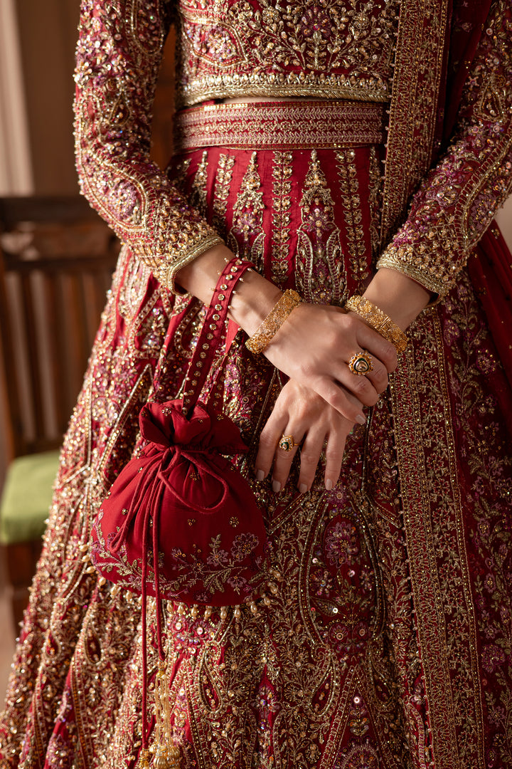 Embroidered bridal pouch by Batik featuring pearls and fine embellishments as a regal accessory. Bridal luxury Pakistani South Asian affordable handbag potli