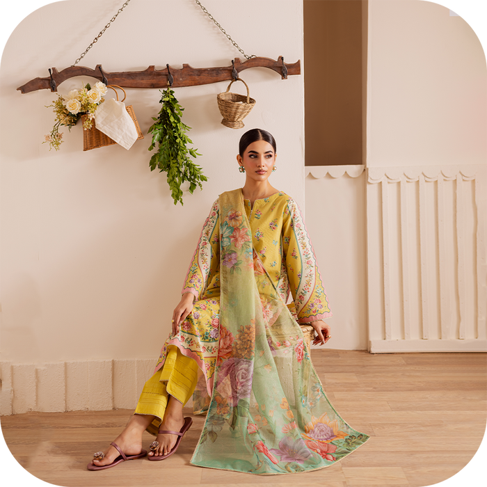 Woman wearing elegant summer pret outfit with minimal embroidery, perfect for a workday.