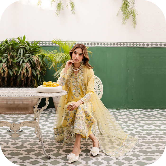 Model wearing BATIK solid pret 3-piece summer outfit in breathable lawn fabric, showcasing minimalist design in SUMMER 2025 collection.