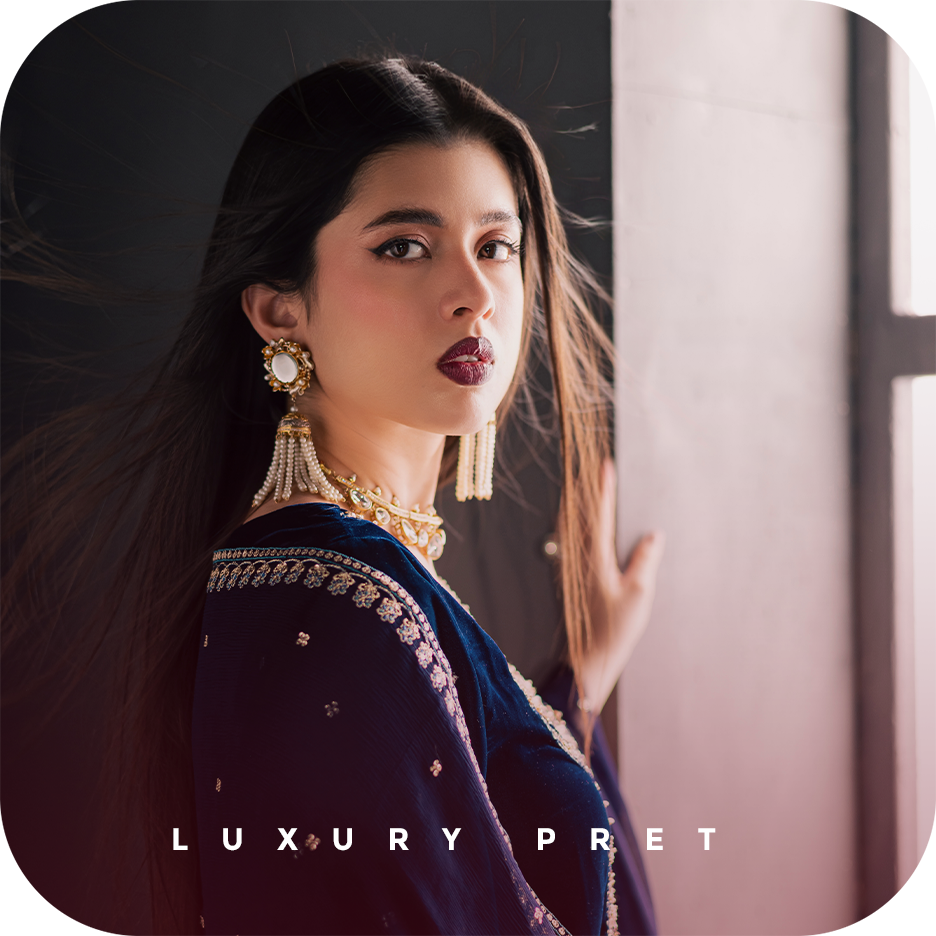 A BATIK luxury pret festive outfit crafted in georgette, chiffon, velvet, raw silk, or organza, photographed in soft evening light to highlight elegant movement, South Asian craftsmanship, and UAE inspired styling.