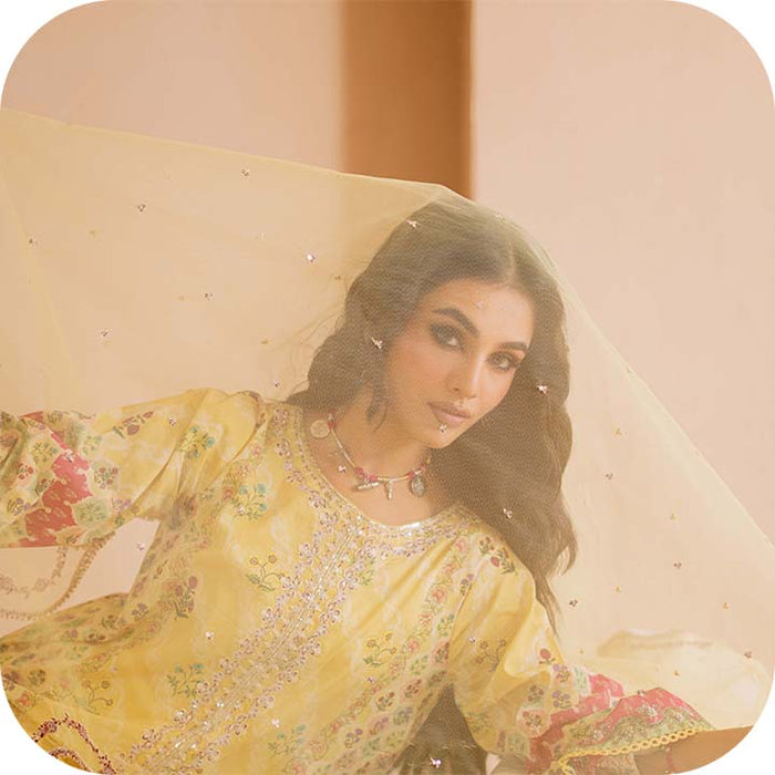 Woman wearing BATIK festive print dress for Eid 2025