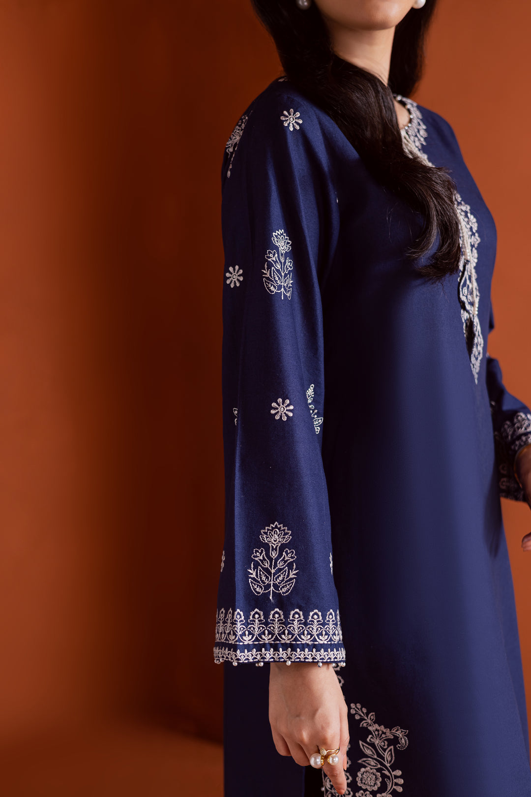 Radiate effortless charm with the Bloom two-piece set, featuring a beautifully composed embroidered midnight blue khaddar shirt that brings elegance due to every detail. The neckline is accented with delicate embroidered tassels, adding a playful yet refined touch.

Paired with matching khaddar culottes, this ensemble offers a graceful and modern silhouette—perfect for daytime festivities or casual gatherings.