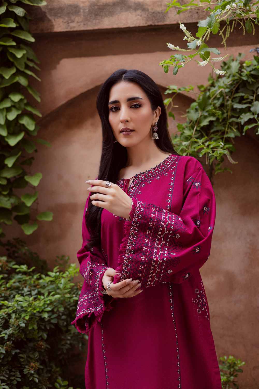 Batik UAE Crossword two piece khaddar set featuring a paneled shirt with cross stitch embroidery, tassel neckline, and fringed sleeves. Affordable ethnic South Asian Desi Indian Pakistani designer wear UAE fashion for teens, adults, girls, and women.