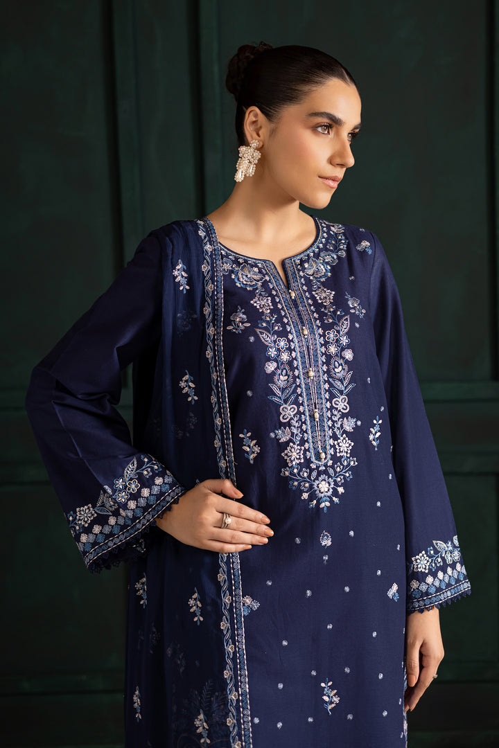 Batik UAE Adoro three piece khaddar set featuring a long blue embroidered shirt with crochet lace finishing paired with embroidered culottes and crinkle dupatta. Affordable ethnic South Asian Desi Indian Pakistani designer wear UAE fashion for teens adults girls and women available in sizes XS S M L XL.