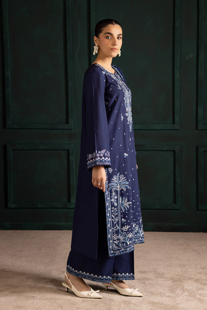 Batik UAE Adoro three piece khaddar set featuring a long blue embroidered shirt with crochet lace finishing paired with embroidered culottes and crinkle dupatta. Affordable ethnic South Asian Desi Indian Pakistani designer wear UAE fashion for teens adults girls and women available in sizes XS S M L XL.
