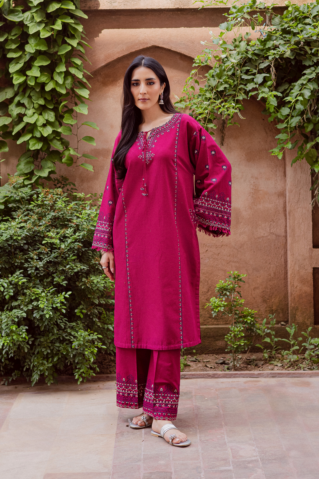Batik UAE Crossword two piece khaddar set featuring a paneled shirt with cross stitch embroidery tassel neckline and fringed sleeves. Affordable ethnic South Asian Desi Indian Pakistani designer wear UAE fashion for teens adults girls and women.