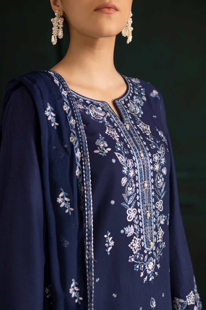 Batik UAE Adoro three piece khaddar set featuring a long blue embroidered shirt with crochet lace finishing paired with embroidered culottes and crinkle dupatta. Affordable ethnic South Asian Desi Indian Pakistani designer wear UAE fashion for teens adults girls and women available in sizes XS S M L XL.