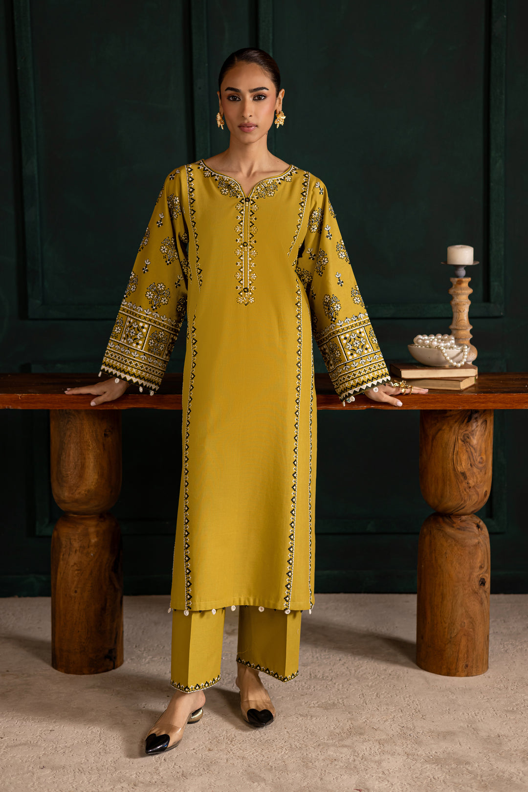 Batik UAE Kantha two piece khaddar set in lemon green featuring embroidered sleeves with mirror and bead detailing. Affordable ethnic Pakistani designer wear UAE fashion.