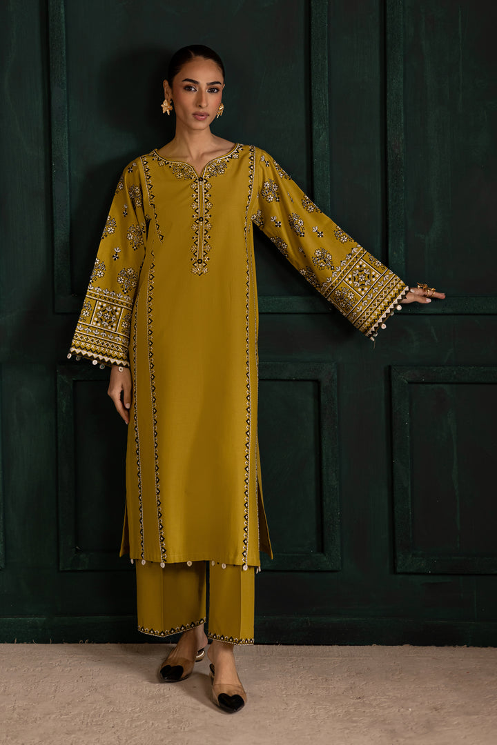 Batik UAE Kantha two piece khaddar set in lemon green featuring embroidered sleeves with mirror and bead detailing. Affordable ethnic South Asian Desi Indian Pakistani designer wear UAE fashion.