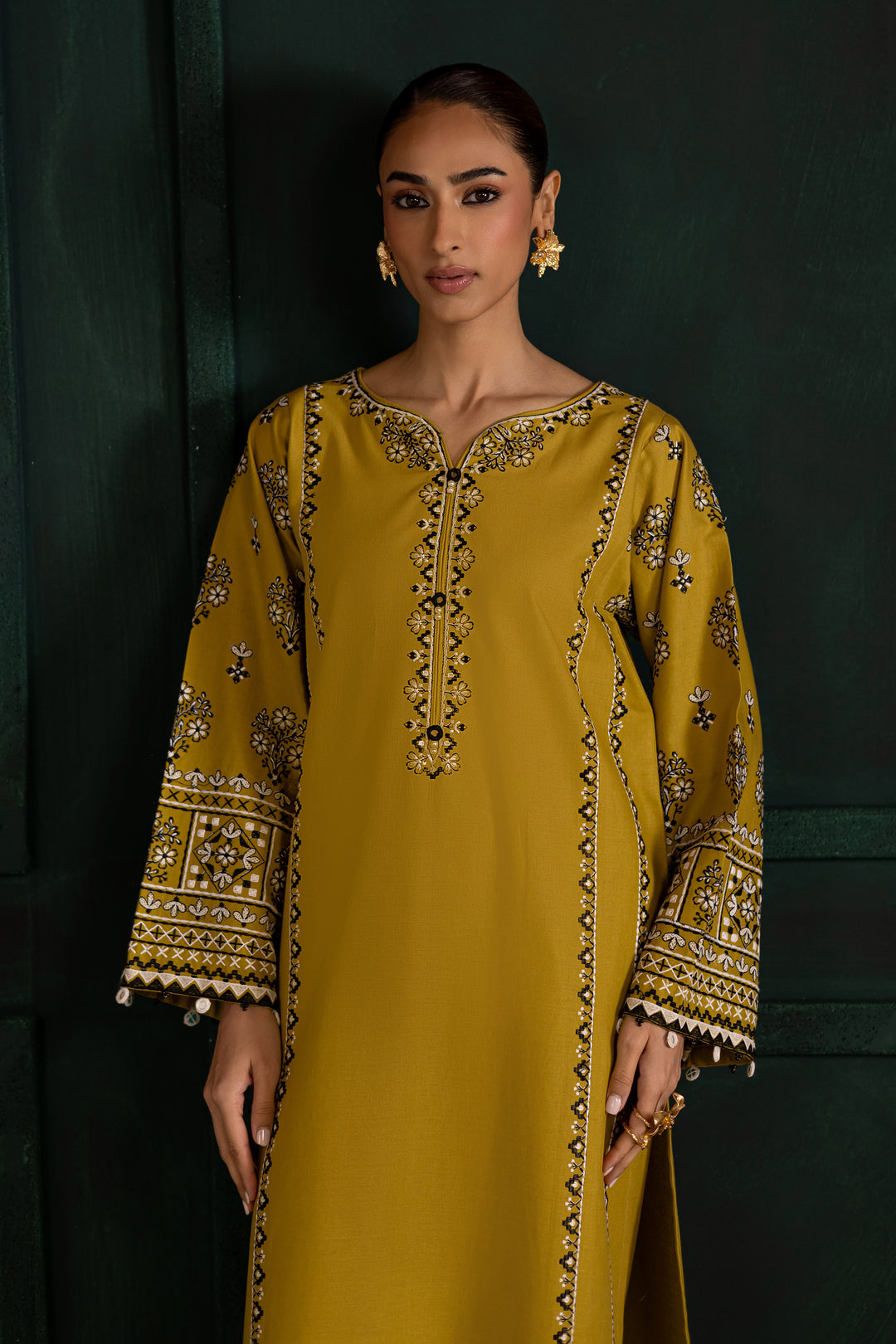 Batik UAE Kantha two piece khaddar set in lemon green featuring embroidered sleeves with mirror and bead detailing. Affordable ethnic South Asian Desi Indian Pakistani designer wear UAE fashion.