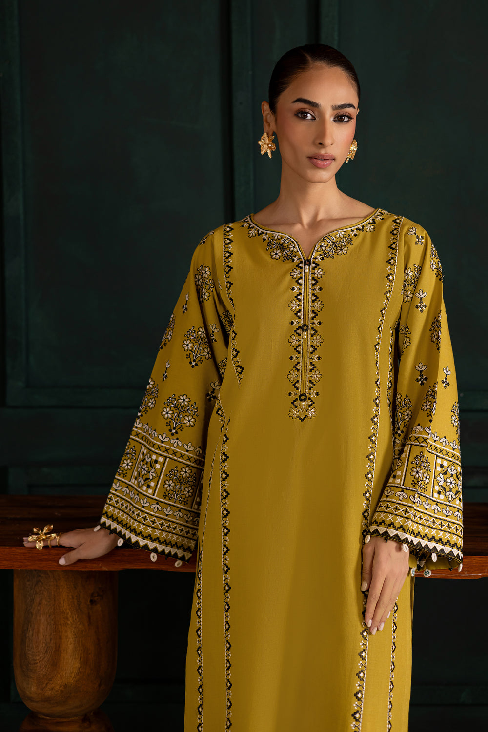 Batik UAE Kantha two piece khaddar set in lemon green featuring embroidered sleeves with mirror and bead detailing. Affordable ethnic South Asian Desi Indian Pakistani designer wear UAE fashion.