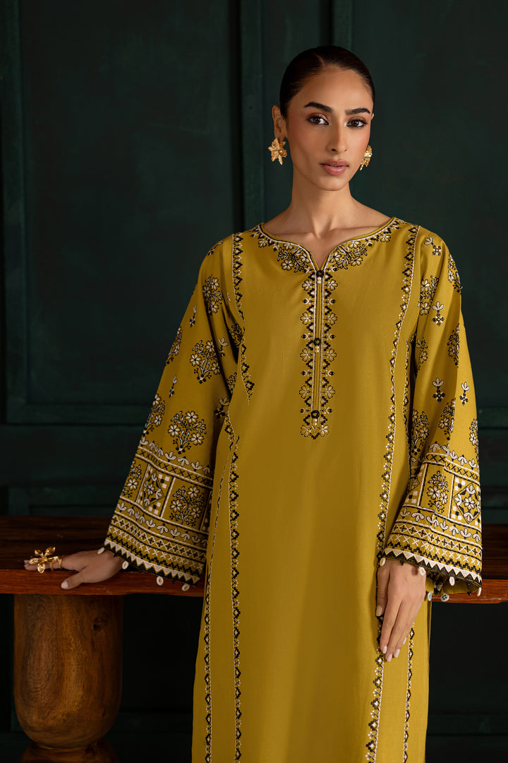 Batik UAE Kantha two piece khaddar set in lemon green featuring embroidered sleeves with mirror and bead detailing. Affordable ethnic South Asian Desi Indian Pakistani designer wear UAE fashion.