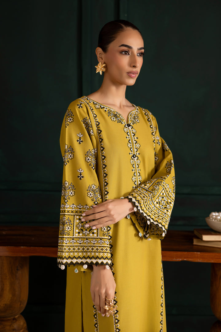 Batik UAE Kantha two piece khaddar set in lemon green featuring embroidered sleeves with mirror and bead detailing. Affordable ethnic South Asian Desi Indian Pakistani designer wear UAE fashion.