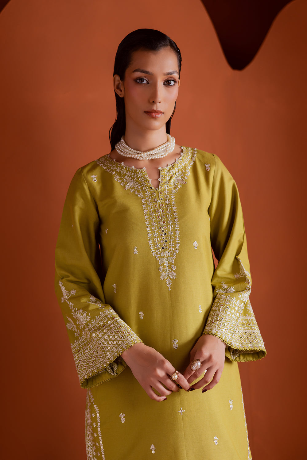 Elegant Pakistani ready-to-wear outfit in pear green khaddar with geometric embroidery and lace finishing, perfect for day-to-evening looks