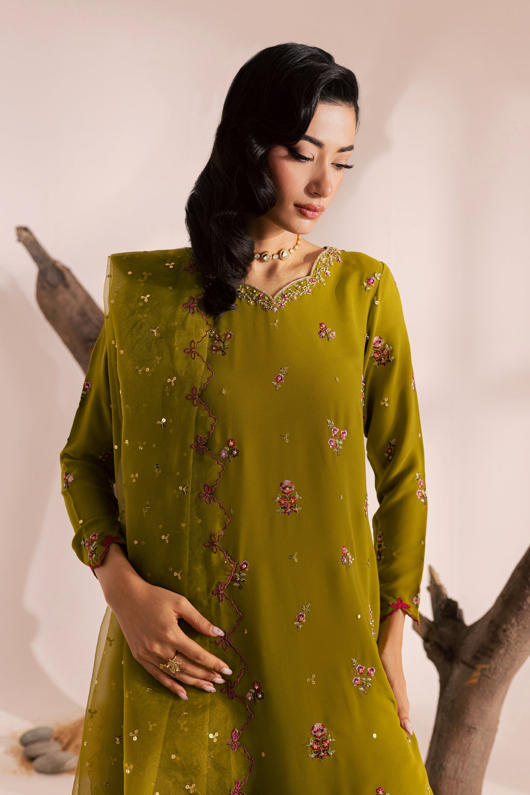 Olive green Pakistani dress featuring intricate embroidery and sequin detailing, paired with a matching dupatta. Elegant festive outfit for women, part of Batik’s ready-to-wear collection with global delivery