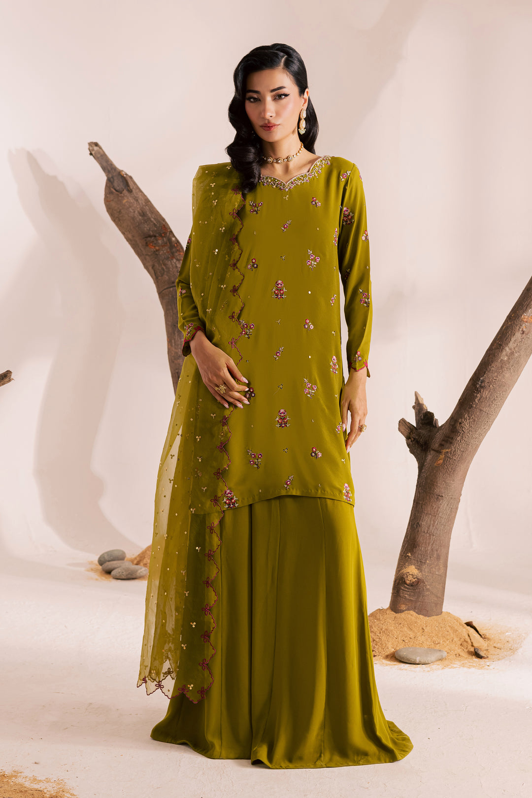 Full-length view of olive green embroidered Pakistani 3-piece suit with matching dupatta and wide trousers. Modern festive ethnic wear from Batik—ready to wear and shipped worldwide