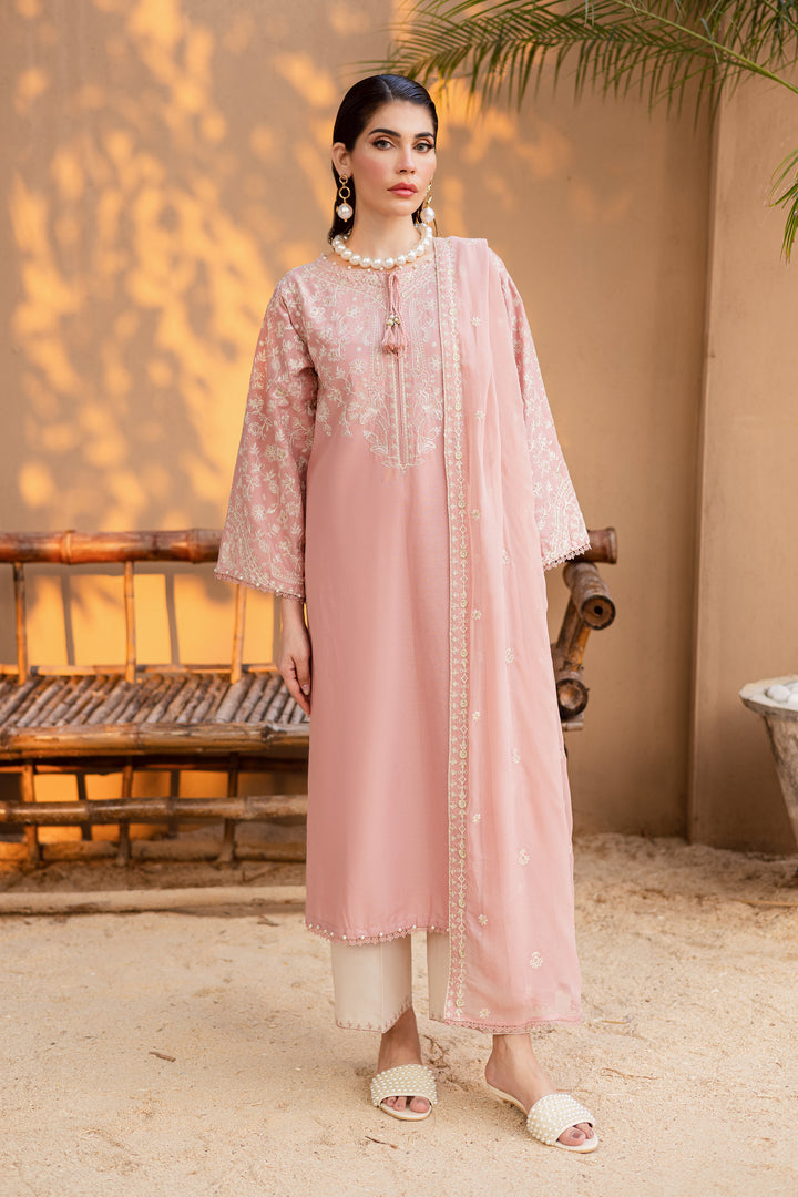 Festive 3-piece Pakistani khaddar dress in taffy pink with hand embroidery and lace accents, ideal for Eid or party wear