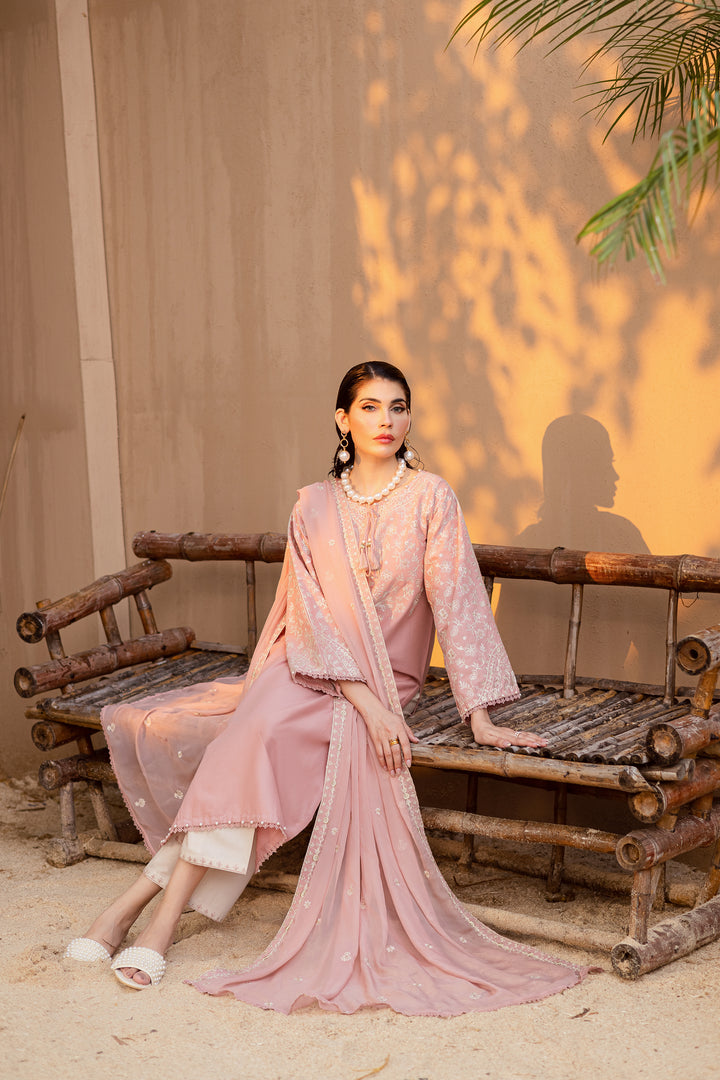 Pink embroidered khaddar shirt paired with off-white embroidered trousers and matching dupatta for timeless Pakistani elegance