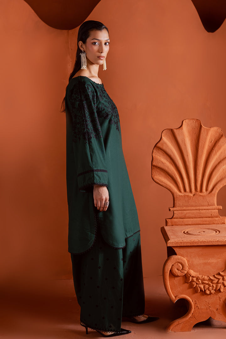 Back view of embroidered khaddar shirt in deep emerald tone - elegant ready-to-wear outfit from Pakistani brand, made for comfort and style