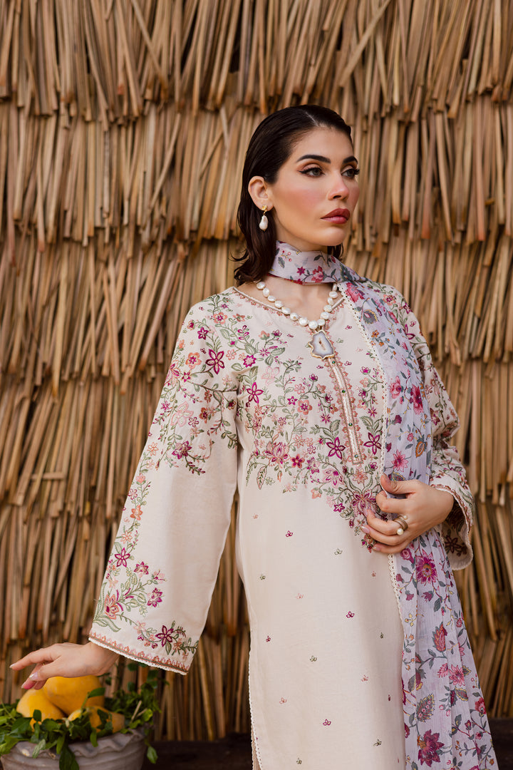 Beige embroidered khaddar 3-piece outfit styled with floral printed dupatta, a timeless Pakistani festive look for women