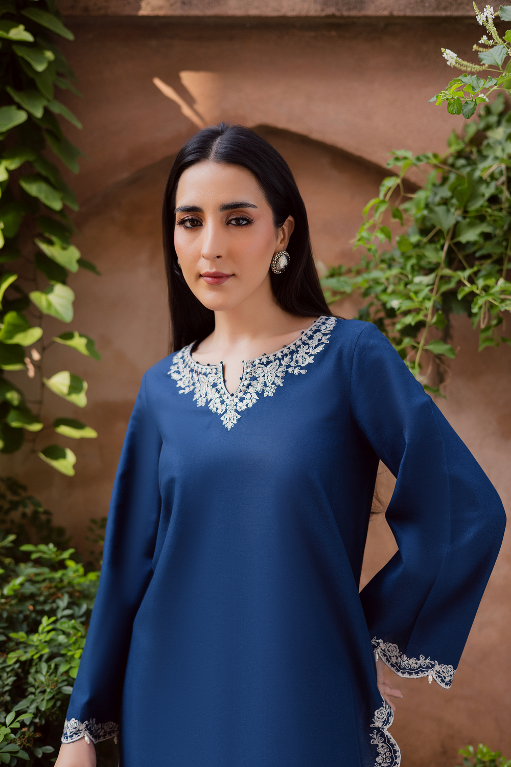 Indian Batik UAE two piece khaddar set featuring a short straight embroidered shirt with scalloped borders keyhole neckline and pearl embellished sleeves paired with a fully embroidered contrasting shalwar. Affordable ethnic South Asian Desi Indian Pakistani designer wear UAE fashion for teens adults girls and women available in sizes XS S M L XL blue white