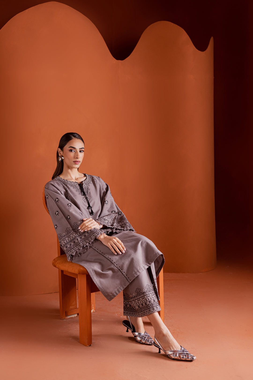 Batik UAE Crossword two piece khaddar set featuring a drop shoulder paneled shirt with cross stitch embroidery tassel neckline and fringed sleeves. Affordable ethnic South Asian Desi Indian Pakistani designer wear UAE fashion for teens adults girls and women.