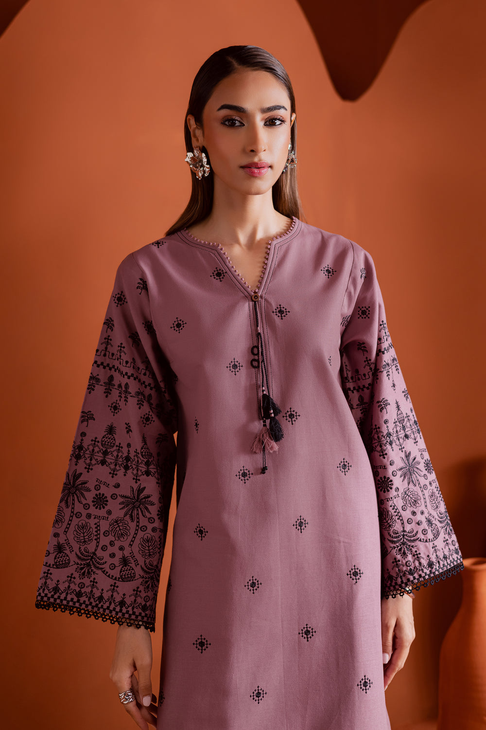 Onion pink embroidered khaddar shirt with black threadwork and lace detailing. A refined ready-to-wear Pakistani suit for women - part of Batik’s premium modest fashion collection. Shop affordable ethnic wear online in UAE, KSA, Qatar, and globally