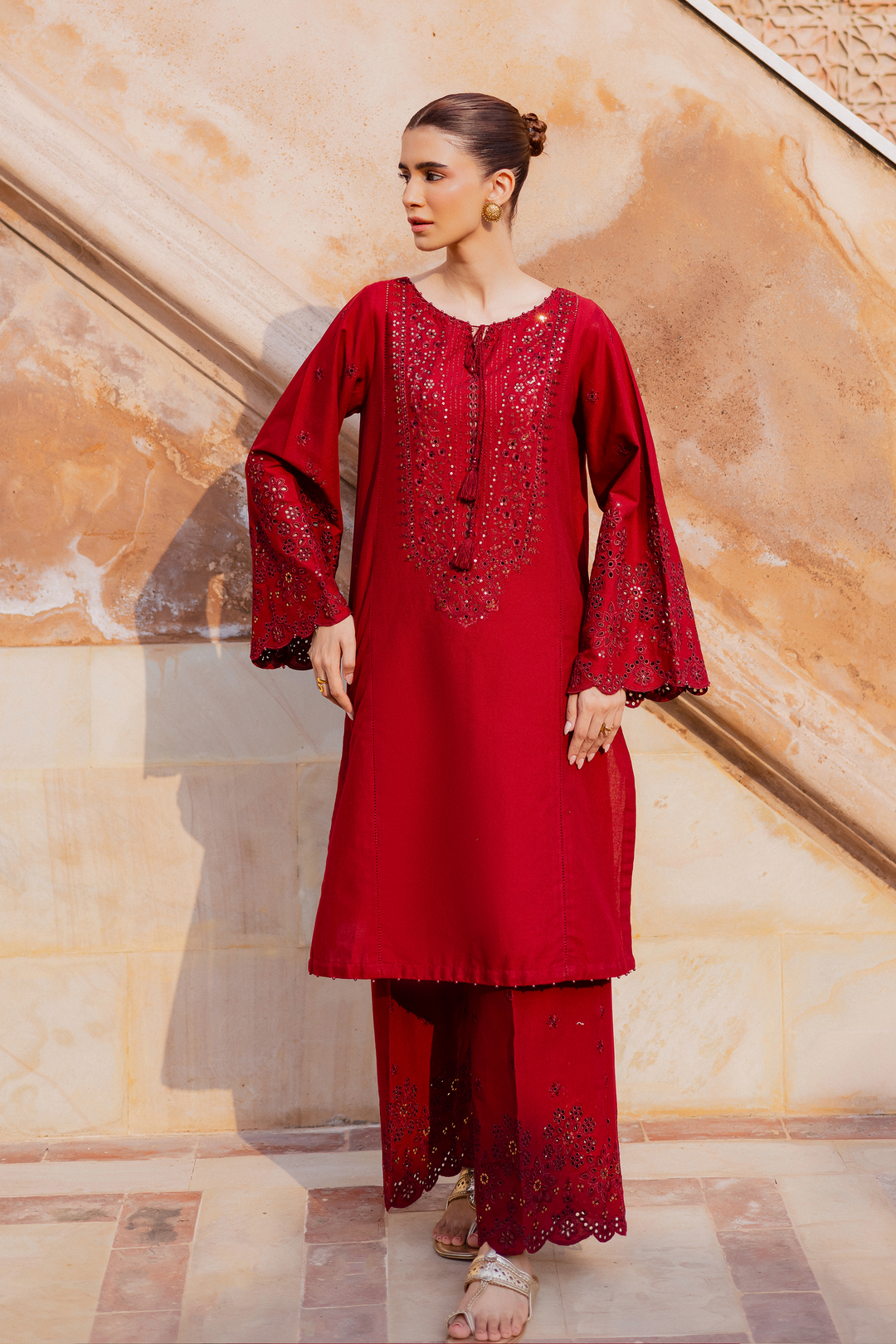 Batik UAE two piece khaddar set featuring a heavily embroidered shirt with boring work tassel embellishments and kabua finished sleeves paired with embroidered khaddar culottes. Affordable ethnic South Asian Desi Indian Pakistani designer wear UAE fashion for teens adults girls and women available in sizes XS S M L XL.