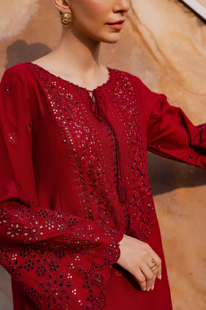 Batik UAE two piece khaddar set featuring a heavily embroidered shirt with boring work tassel embellishments and kabua finished sleeves paired with embroidered khaddar culottes. Affordable ethnic South Asian Desi Indian Pakistani designer wear UAE fashion for teens adults girls and women available in sizes XS S M L XL.