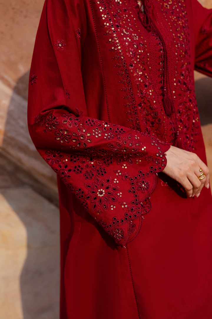 Batik UAE two piece khaddar set featuring a heavily embroidered shirt with boring work tassel embellishments and kabua finished sleeves paired with embroidered khaddar culottes. Affordable ethnic South Asian Desi Indian Pakistani designer wear UAE fashion for teens adults girls and women available in sizes XS S M L XL.
