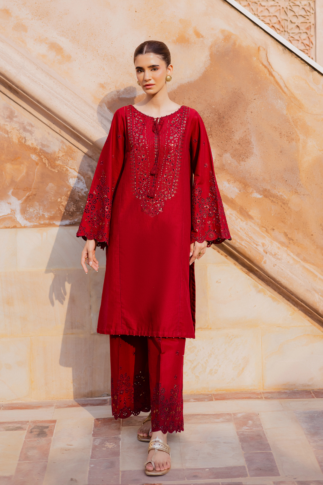Batik UAE two piece khaddar set featuring a heavily embroidered shirt with boring work tassel embellishments and kabua finished sleeves paired with embroidered khaddar culottes. Affordable ethnic South Asian Desi Indian Pakistani designer wear UAE fashion for teens adults girls and women available in sizes XS S M L XL.