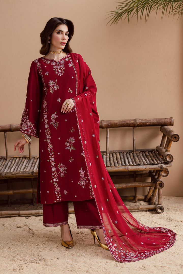 Beetroot red embroidered khaddar 3 piece suit with lace detailing and matching crinkle dupatta. Elegant Pakistani festive wear available with global delivery.