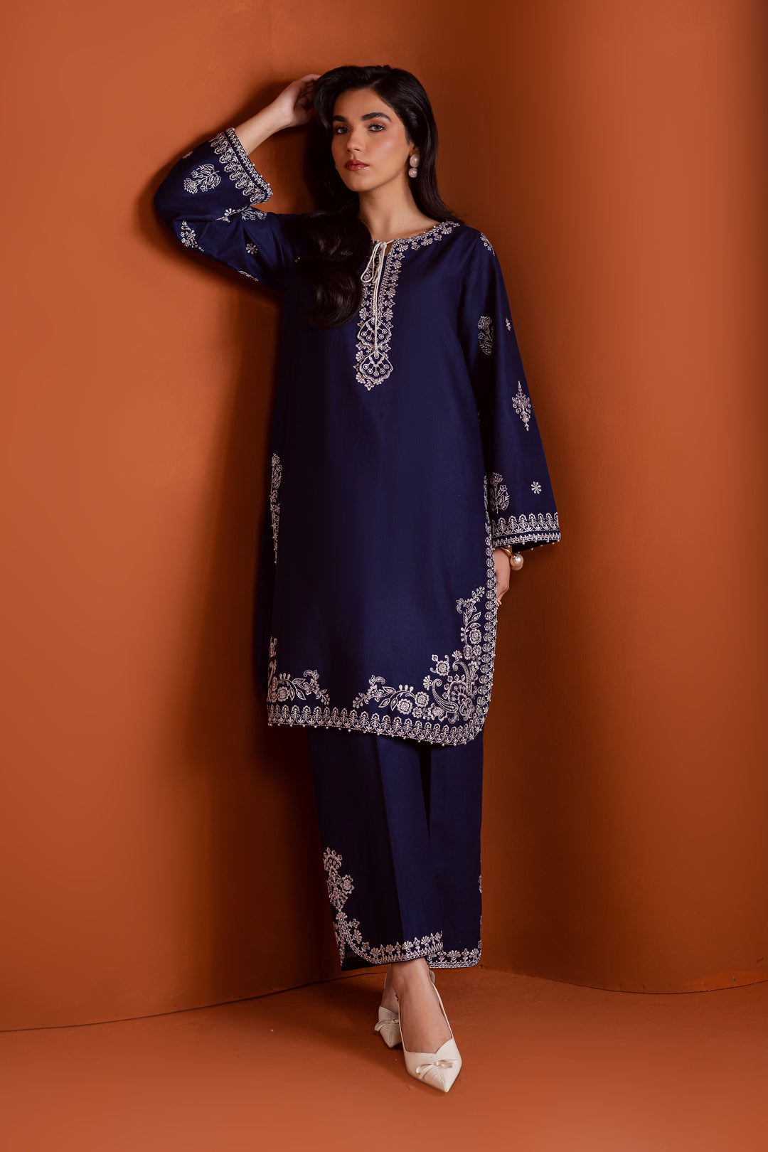 Radiate effortless charm with the Bloom two-piece set, featuring a beautifully composed embroidered midnight blue khaddar shirt that brings elegance due to every detail. The neckline is accented with delicate embroidered tassels, adding a playful yet refined touch.

Paired with matching khaddar culottes, this ensemble offers a graceful and modern silhouette—perfect for daytime festivities or casual gatherings.