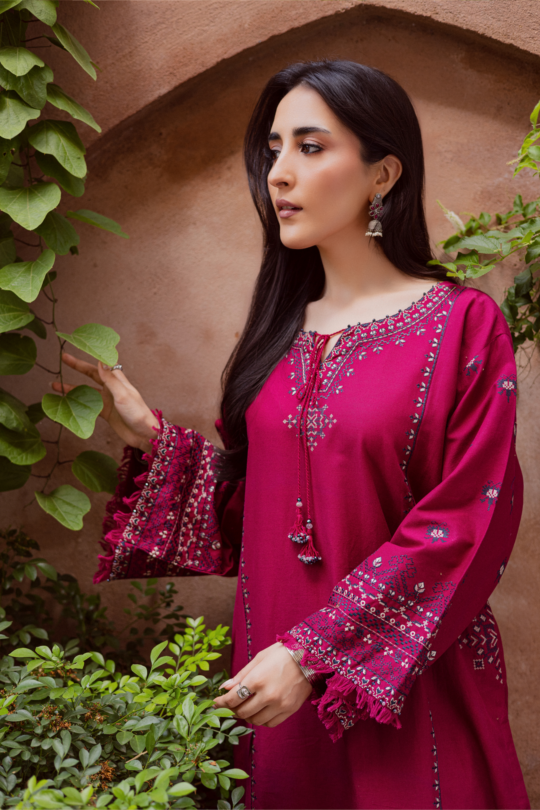 Batik UAE Crossword two piece khaddar set featuring a paneled shirt with cross stitch embroidery, tassel neckline, and fringed sleeves. Affordable ethnic South Asian Desi Indian Pakistani designer wear UAE fashion for teens, adults, girls, and women.