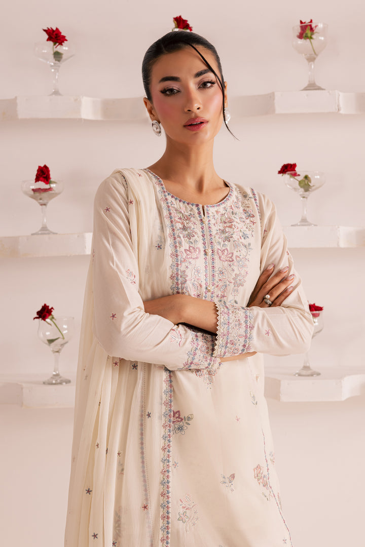 Traditional South Asian embroidered outfit for women in soft ivory -Pakistani ethnic wear with pastel floral embroidery, chiffon dupatta, and cotton trousers. Ideal for Eid, parties, or semi-formal events. Easy delivery across UAE and worldwide
