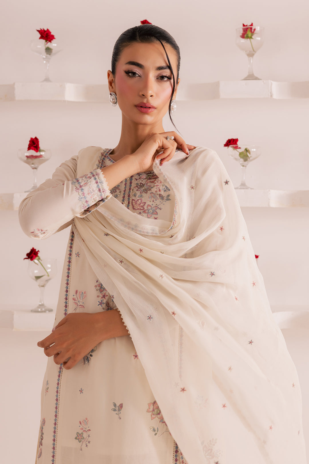 Off-white embroidered 3-piece Pakistani suit with organza and lace detailing, paired with cambric culottes and matching dupatta. A timeless festive look from Batik -ready to wear, affordable, and delivered across UAE and worldwide